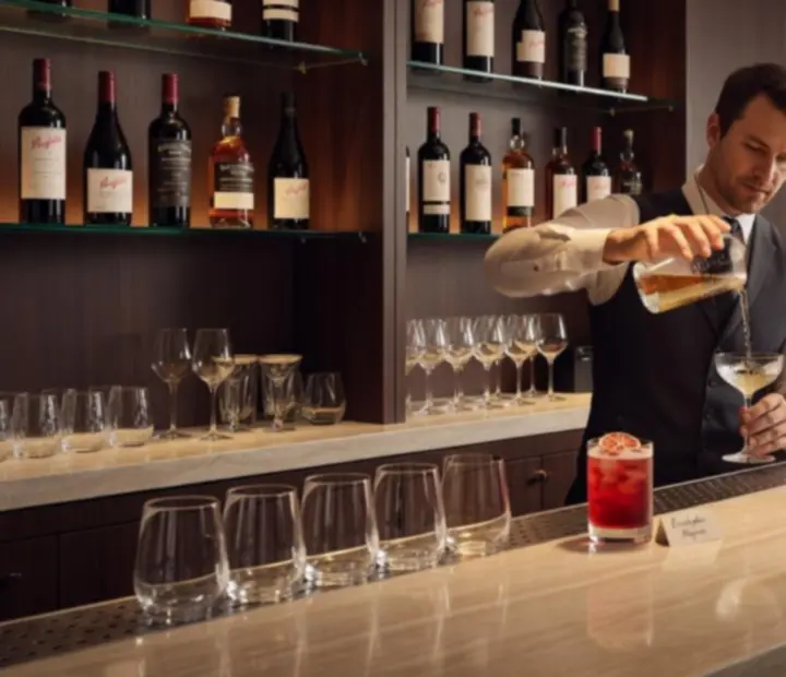 Bartender preparing a signature cocktail at a refined Australian bar